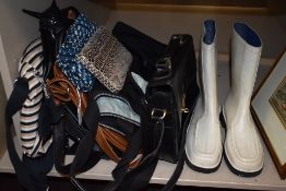 A selection of hand and clutch bags also a pair of wellies