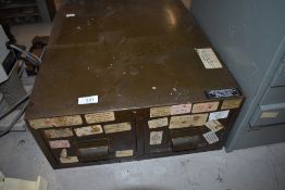 A postcard sized metal file cabinet two drawer unit