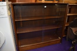 A vintage sapele bookcase, labelled Herbert Ellis