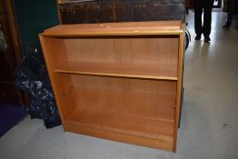 A vintage light beech bookcase, labelled for Herbert Ellis, width approx. 91cm