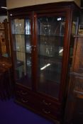 A modern mahogany display cabinet