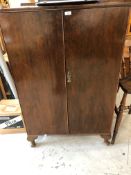 An early 20th Century mahogany tall boy, interior drawers