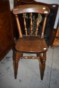An Edwardian childs high chair having mahogany frame