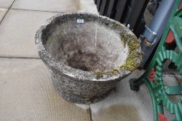A cast stone style garden trough or planter
