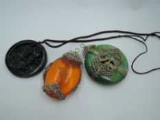 A Chinese green hardstone disk pendant having fine brass decorative dragon and butterfly overlaid