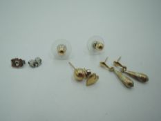 Two pairs of 9ct gold stud earrings and two odd gold earrings, approx 1g