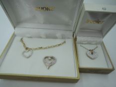 A cased Evoke Gold n Ice 9ct gold bracelet with crystal set heart charm, a matching Gold n Ice
