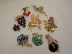 Eight named costume brooches including Butler, Kirks Folly, Suzanne Bjontegard, Ciro, Joan Rivers