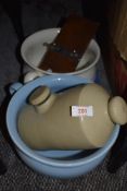 Two chamber pots a tie press and a stone hot water bottle.