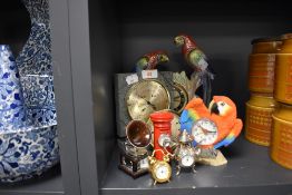 A selection of vintage and modern clocks including bright lustre finish parrot mantel clock embossed