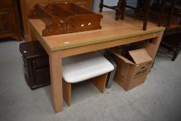 A modern laminate light oak effect table