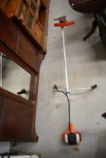 An Echo petrol garden strimmer
