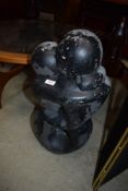 A modern cast garden sculpture or figure of two embracing