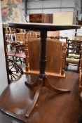 A 19th Century oak pedestal occasional table having turned column and triple splay legs, diameter