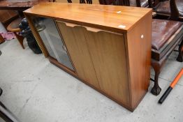 A mid century office or library book and cupboard unit wit glazed front