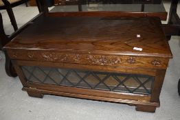 A late C20th oak effect TV base unit