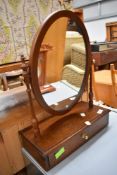 A modern reproduction dressing table mirror