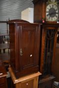 A late Victorian stained pine pot cupboard