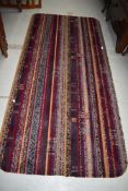 A vintage carpet piece, made into rug size, rounded edges, approx. 192 x 92cm