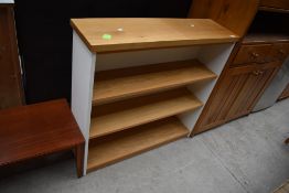 A modern light oak and white laminate set of shelves