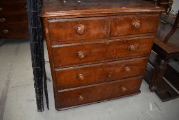 A late Victorian pine chest of two over three drawers having original turned wood handles