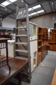 A set of traditional fold out pine step ladders