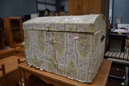 A vintage dome top trunk of small proportions (width approx.49cm) and a strung top stool