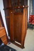 An early 20th Century oak double bed frame including irons, no base or mattress