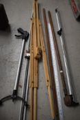 A selection of gardening tools a meter rule and artist easle