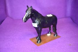 A Beswick study, Dales Pony, Maisie, model no 1671, on home made wooden plinth