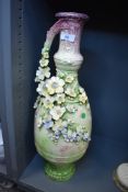 A late 19th/early 20th century statement floor vase having green and mauve mottled ground with