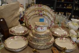 a part dinner service by Royal Doulton in the English Rose design including tureen chargers etc