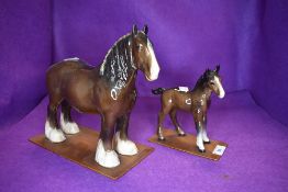 Two Beswick studies, Shire Mare, brown 818 and Shire Foal, brown, 951, both on home made wooden