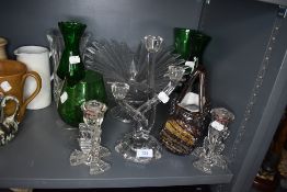 An assortment of art glass, candle sticks and glasses.