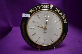 A vintage pub or tavern advertising wall mounted clock by Smiths for Watney Mann Ale