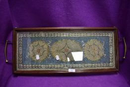 A stunning Victorian tea tray having brass lions feet with brass inlay and glass bead decoration