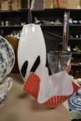 Two pieces of art statement glass, a large black and white spot vase and napkin