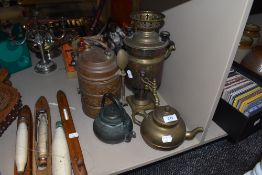 A brass and copper stackable Chinese food container a similar tea pot and small samovar