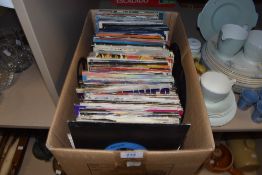 A box of 45rpm singles with a good selection of various 7inch singles pop rock and 80's interest