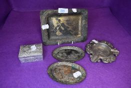 A selection of pewter Chinoiserie items including small trays dish and lidded container