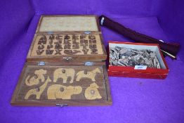 A small Tucks Zag Zaw puzzle and similar wooden puzzle games