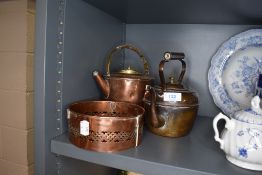 Two copper kettles and a burner or similar.
