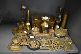 A selection of brass wares including candle sticks horse brass and bells