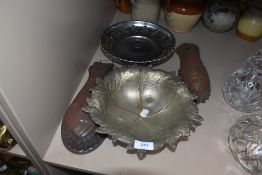 A selection of metal wares including fish shaped moulds and pressed leaf dish