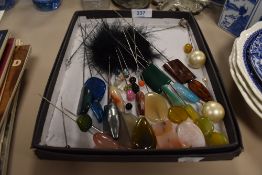 A selection of various hat and dress pins most having semi precious stone tops