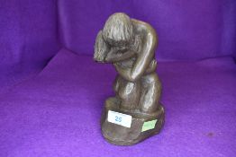 A resin cast sculpture of two lovers embracing