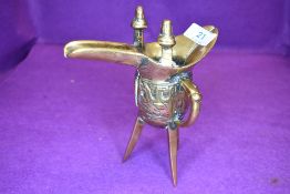 An antique Chinese ceremonial Jue wine vessel or taotie having archaic design and good signs of age