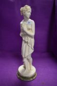 A figure of a Greek or Roman styled bather