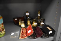 A selection of optical devices including opera glasses spectacles and telescope