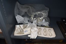 A bridal vale and two white and sequin hand or clutch bags